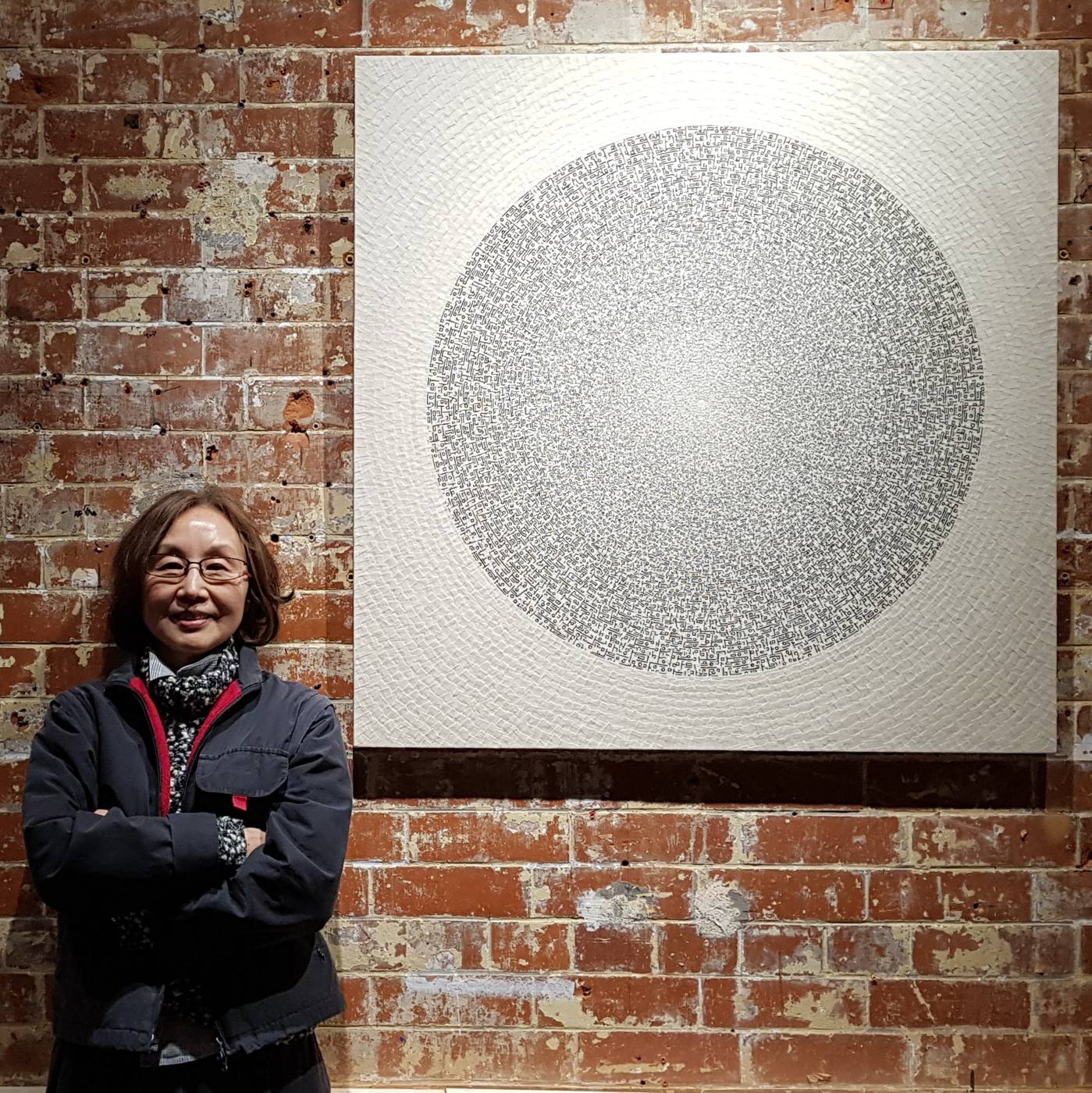 Soon Yul Kang with a collage work